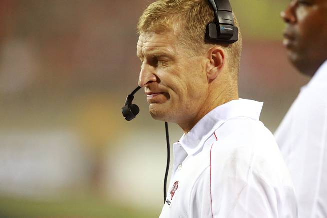 UNLV head coach Bobby Hauck closes his eyes on the sidelines during the fourth quarter of their game against Northern Arizona Saturday, Sept. 8, 2012 at Sam Boyd Stadium. The Lumberjacks upset the Rebels 17-14.